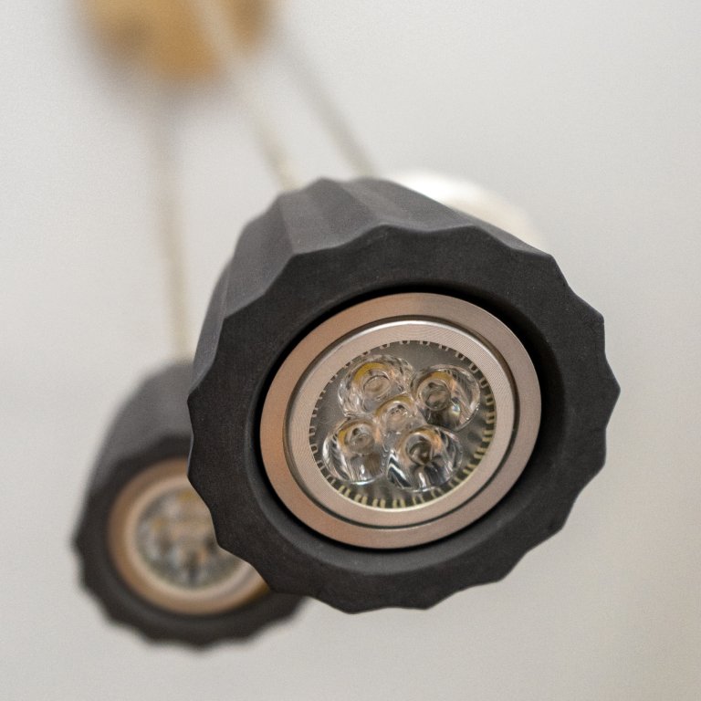 Detail of handmade Origami ceramic light fixture made of porcelain and stoneware with LED bulb