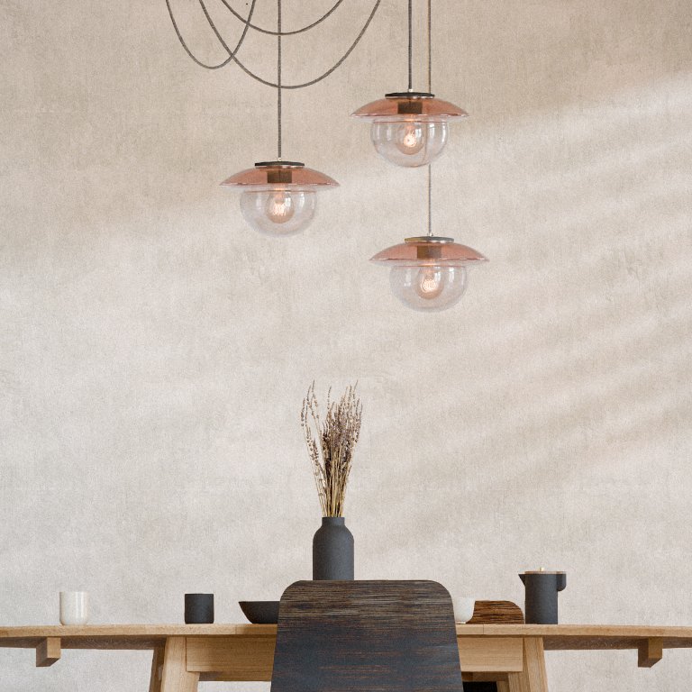 Set of Lens crystal chandeliers above a dining table